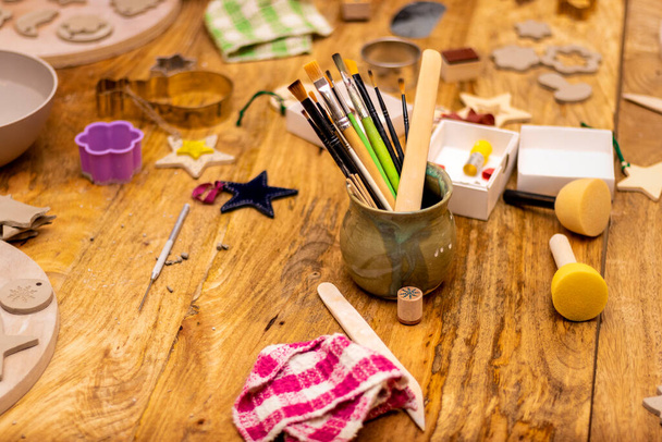 Ceramics workshop. Work table with tools. - Photo, Image