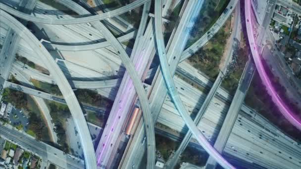 Aerial descending footage of complex multilevel highway interchange. Birds eye view of traffic on trunk road. Computer added visual effects. - Footage, Video