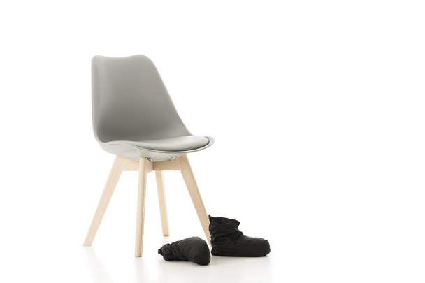 Office Chair and Pair of Back Shoes on White - Valokuva, kuva