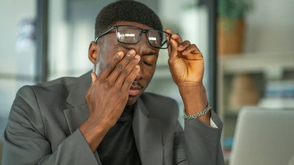 Man takes off his glasses and rubs his eyes - Photo, Image