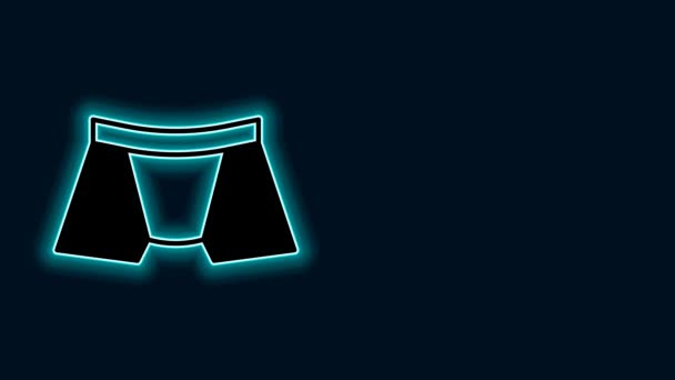 Žhnoucí neonové linie Pánské kalhotky ikona izolované na černém pozadí. Mužské spodní prádlo. Grafická animace pohybu videa 4K. - Záběry, video