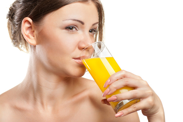 Young beautiful woman drinking orange juice - Fotografie, Obrázek
