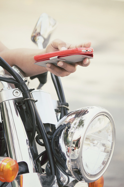 Using smart phone with motorcycle - Photo, Image