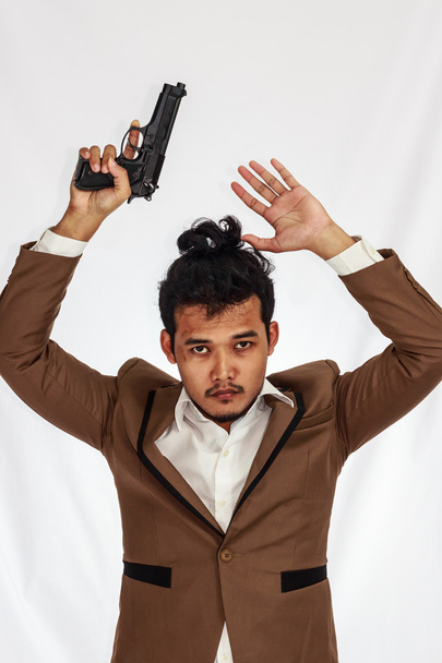 young Business Man Holding Gun, surrender. - Photo, Image