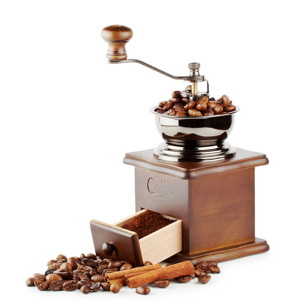 Moedor de café de madeira com feijão e canela
 - Foto, Imagem