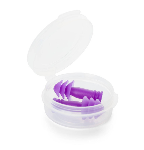 Container with ear plugs on white background - Photo, Image