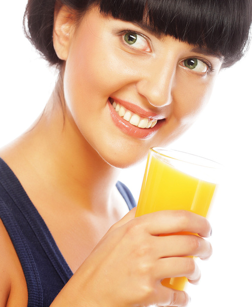 brunette woman holding orange juice - Foto, Imagen