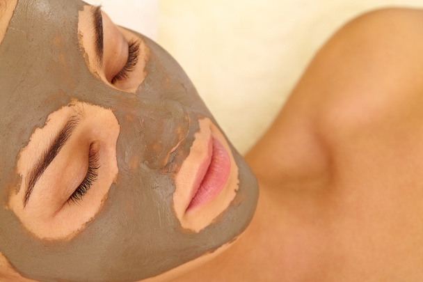 Woman with clay mask on face - Photo, Image