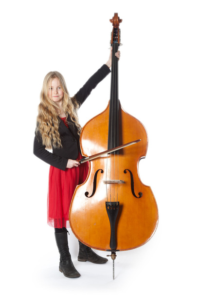 young girl plays double bass in studio - Photo, Image