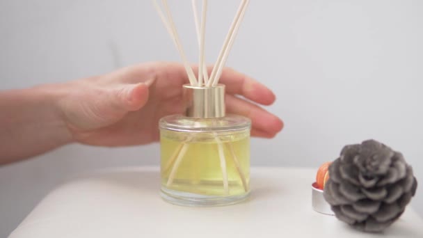 Woman putting reed diffuser on table. - Footage, Video