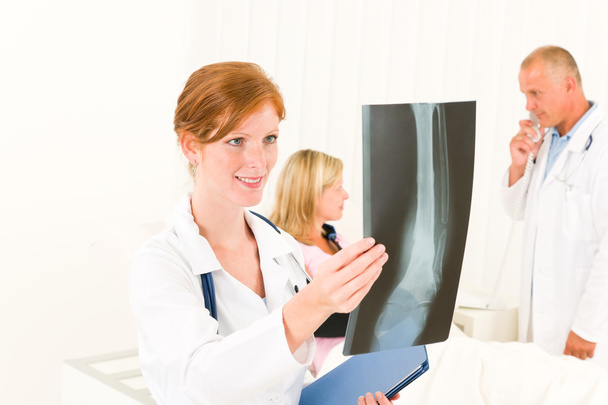 Medical doctors look x-ray patient broken arm - Photo, Image