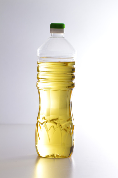 Sunflower oil on the white background - Фото, изображение