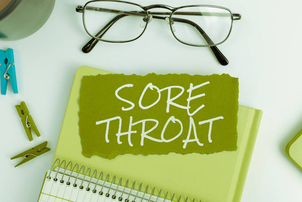 Hand writing sign Sore Throat, Business approach Inflammation ot the pharynx and fauces resulted from an irritation - Photo, Image