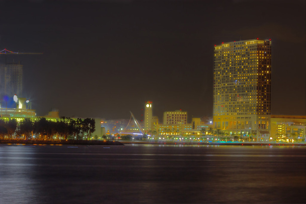 Partial San Diego skyline over water at night - Photo, Image