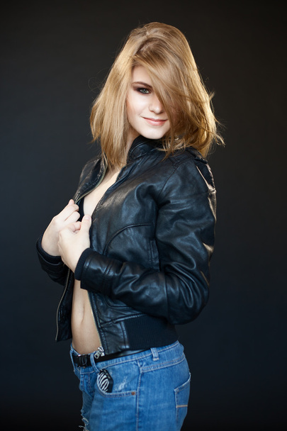 beautiful sensual sexy girl blonde in a leather jacket   - Foto, afbeelding