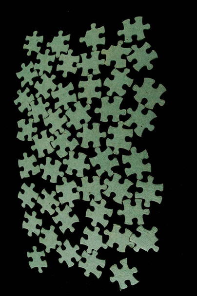 puzzle pieces on a black  background - Photo, Image