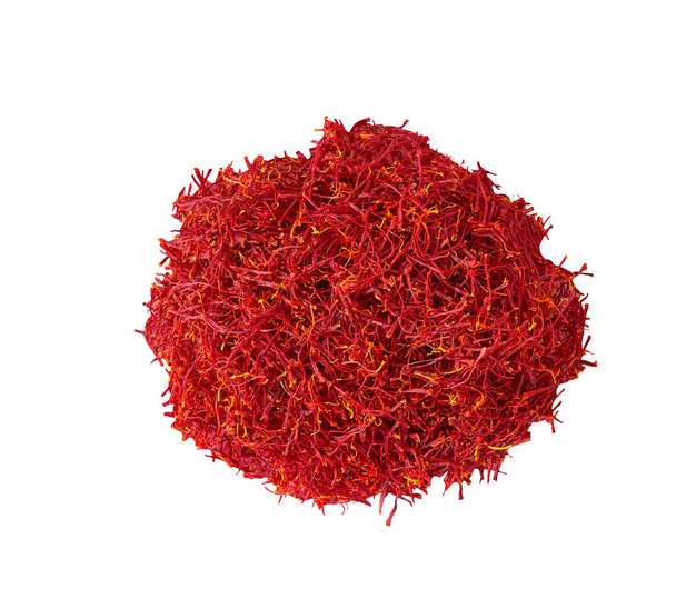 Pile of stigmas saffron isolated on white background, top view. Saffron flavor and coloring ingredient. - Photo, Image
