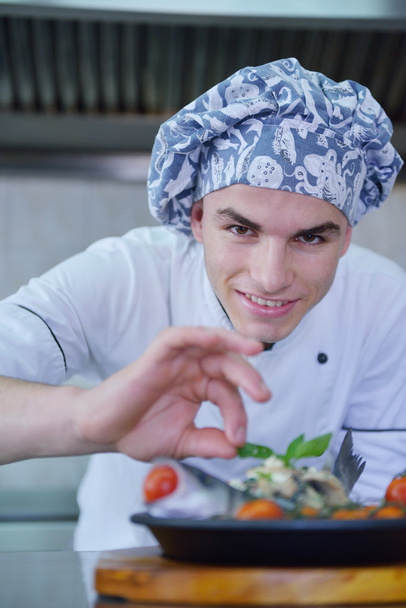 Handsome chef dressed in white uniform - Photo, image