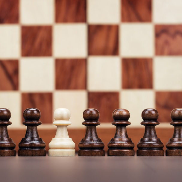 uniqueness concept over chessboard background - Фото, изображение