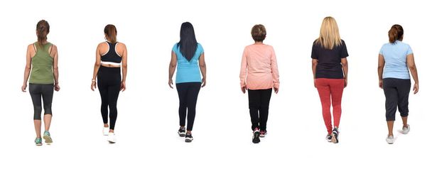 espalda ver grupo de mujeres en ropa deportiva caminar sobre fondo blanco - Foto, Imagen