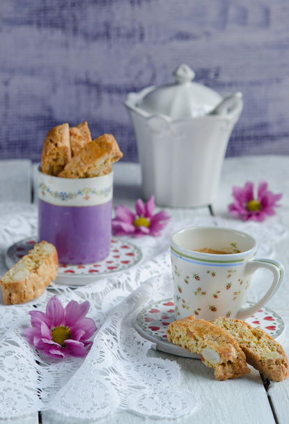 close-up view of Italian homemade biscotti cookies with almond and a cup of coffee - Fotoğraf, Görsel