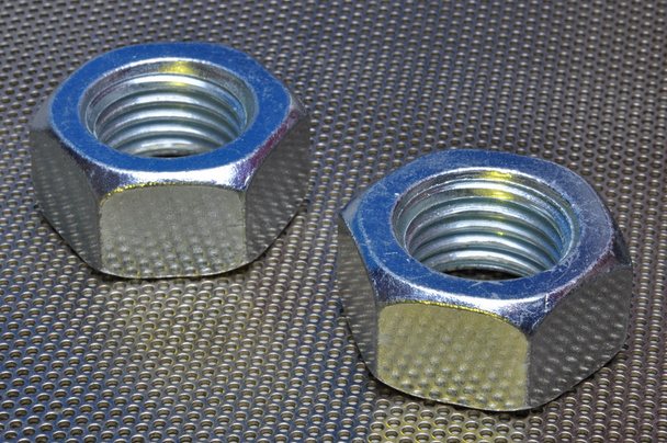 Metal yüzeyi iki çelik somun - Fotoğraf, Görsel