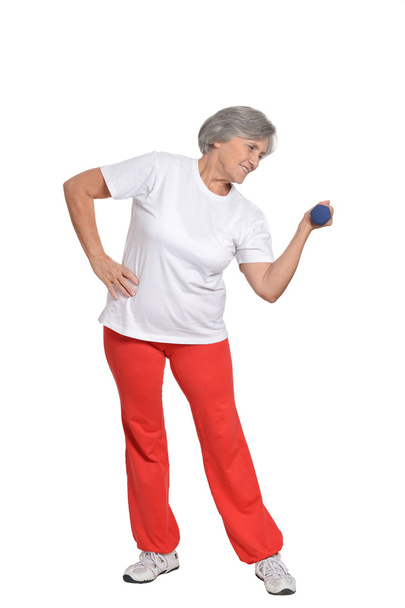 Senior woman exercising with dumbbells - 写真・画像
