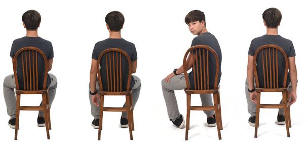 group of same teen sitting on back view tuned and looking at camera on white background - Photo, Image