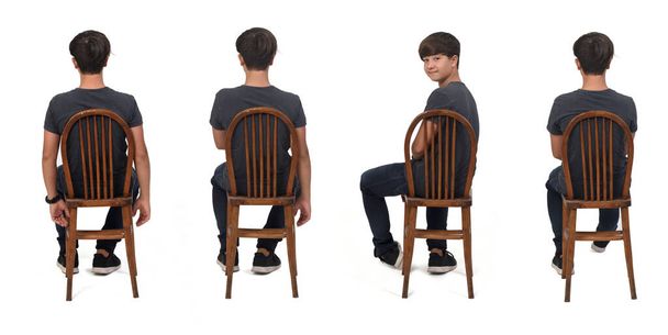 arrière vue de vairous poses de même adolescent assis sur chaise tourné et regardant caméra sur fond blanc - Photo, image