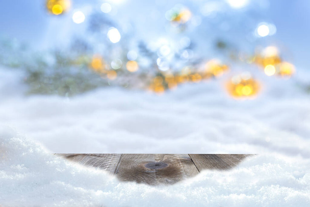 Winter christmas background with wooden table and blur abstract lights - Foto, imagen