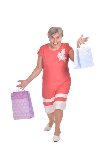 Old woman with shopping bags - Photo, image