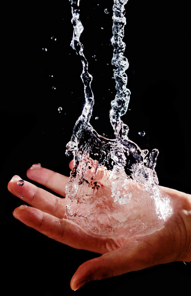 Hand and splashing water - Фото, изображение