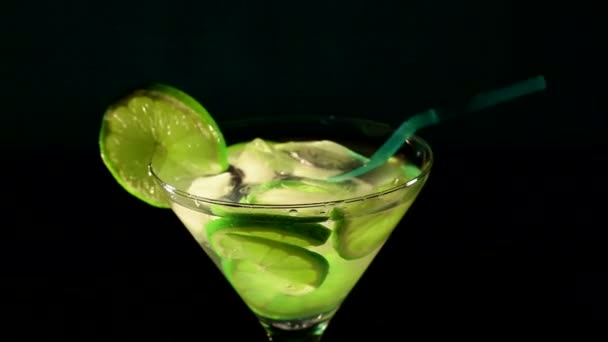 Rotating cocktail with a lime. Top  view - Footage, Video