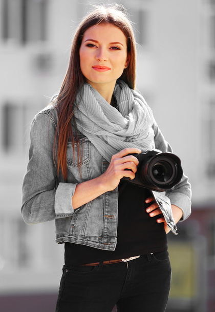 Young photographer taking photos outdoors - Fotoğraf, Görsel