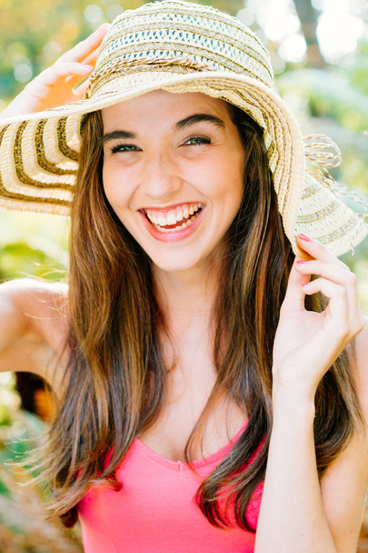 Happy girl with pamela laughing - Фото, изображение