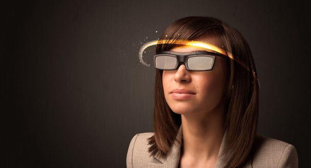 Pretty woman looking with futuristic high tech glasses  - Foto, imagen
