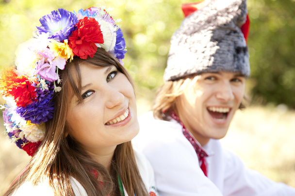 Slav girl with wreath and young cossack at nature - Photo, Image