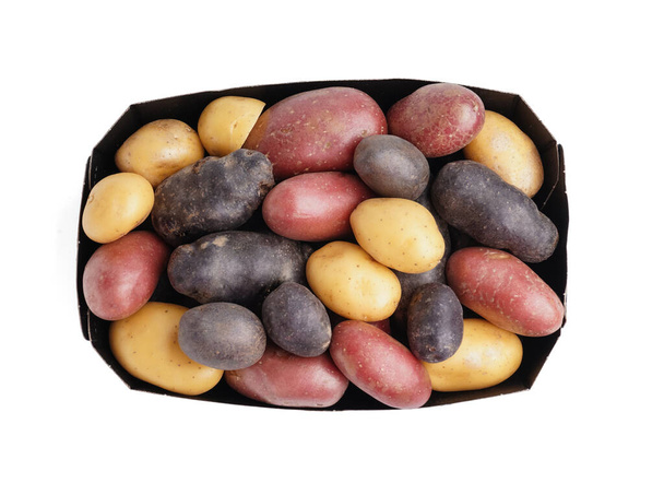 Cardboard box with different types of raw potatoes on white background - Photo, Image
