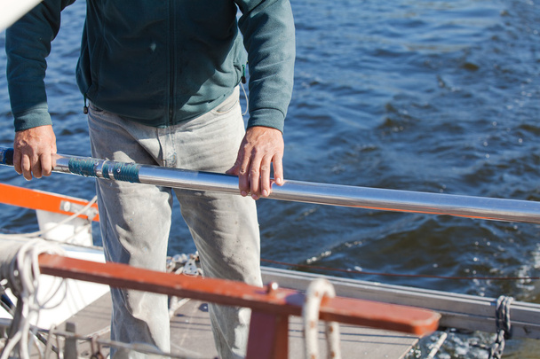 Man's hand keeps steering of riverboat - Φωτογραφία, εικόνα