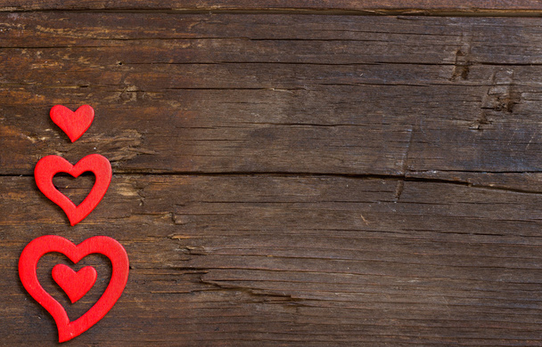 Rustieke harten op een houten achtergrond - Foto, afbeelding