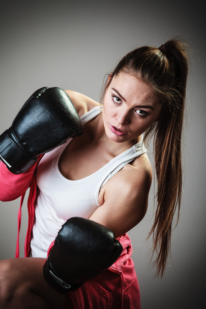 Woman in black gloves boxing - 写真・画像