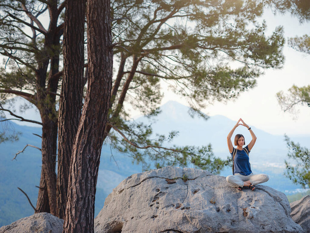 woman traveler walking by Lycian Way trail mountains in Turkey near Antalya. Woman meditating yoga alone in sunrise mountains. concept of spiritual relaxation for travel. Harmony with nature. - Photo, Image