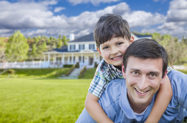 Mixed Race Father and Son Piggyback in Front of House - Photo, Image