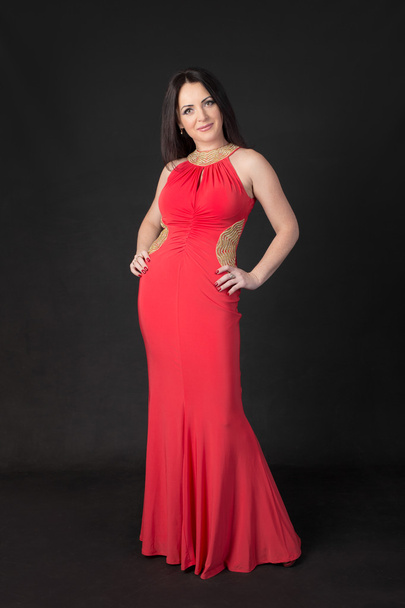 woman in a red dress - Foto, afbeelding
