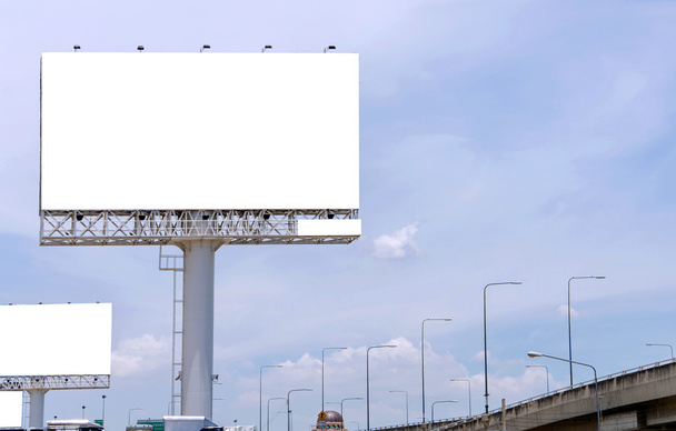 large blank billboard on road with city view background - Photo, Image