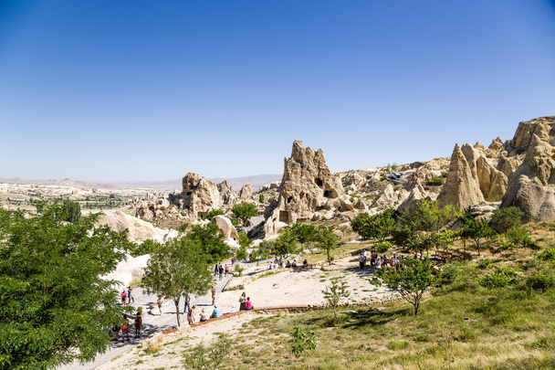 CAPPADOCIA, TURKEY - JUN 25, 2014: Photo of mountain landscape with a medieval cave monastery complex in the rocks in the National Park of Goreme - Fotografie, Obrázek