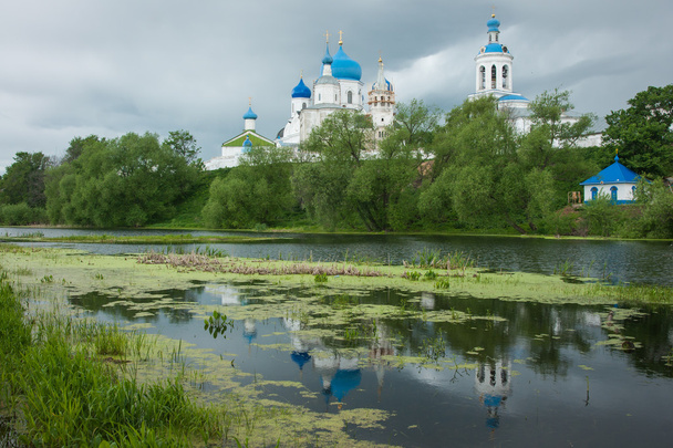 White church with blue domes - Foto, immagini