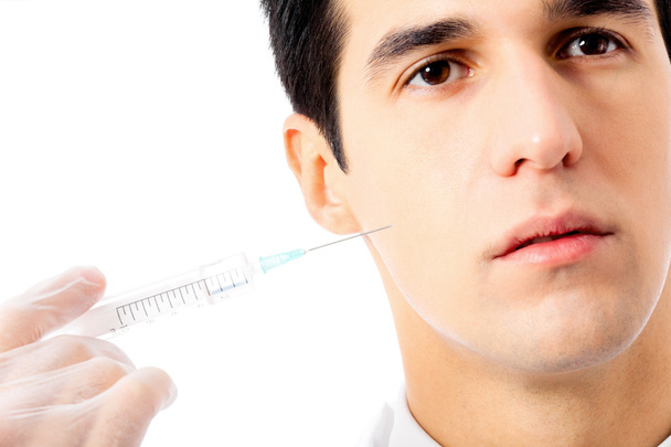 Man with syringe, isolated on white - Foto, afbeelding