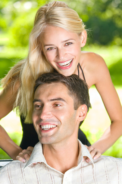 Portrait of young happy attractive couple together, outdoors - Foto, Imagen