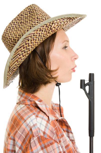 Cowboy woman with a gun on a white background. - 写真・画像